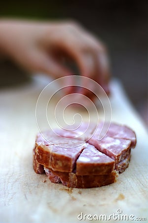 Garlic sausage on a wooden plank Homemade breakfast Stock Photo